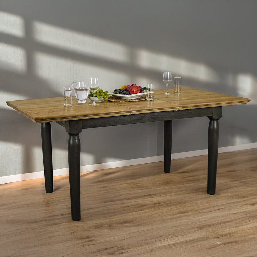 An overall view of the Boston Oak Extending Dining Table. There is a water pitcher and several glasses on top, as well as a platter of fruit.