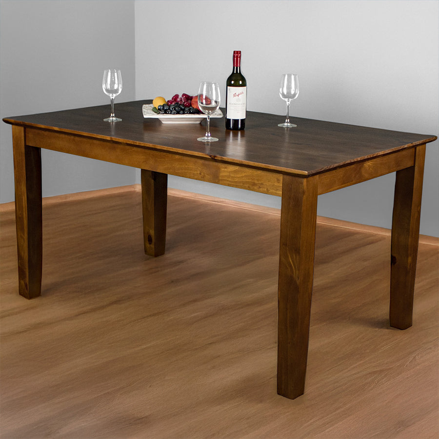 An overall view of the Hamilton Rimu Stained Dining Table (1500mm). There is a platter of fruit on top, three wine glasses and a bottle of wine on top.