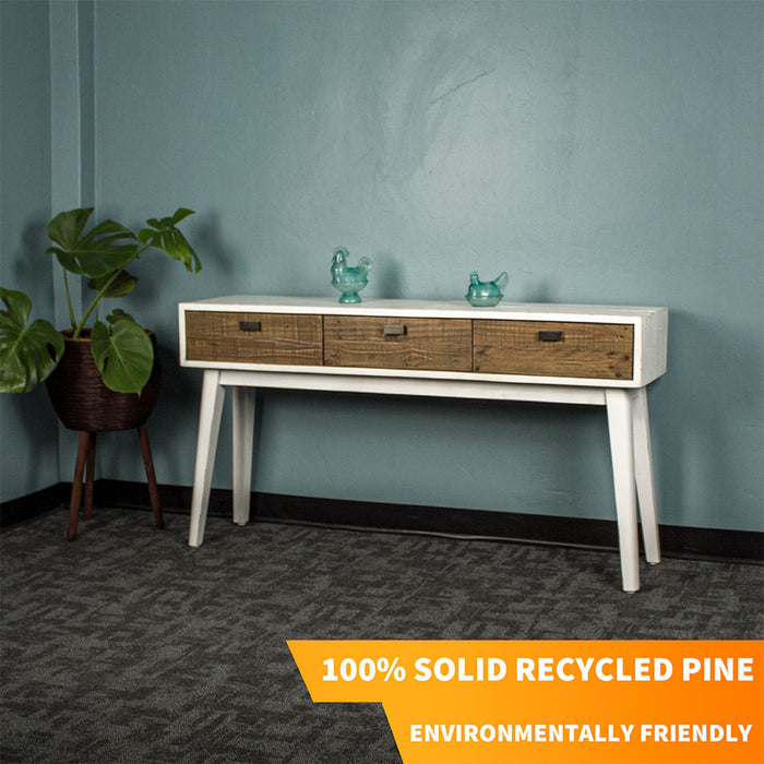 Front of the Nova Recycled Pine Console Table with three drawers. There are two blue glass ornaments on top.