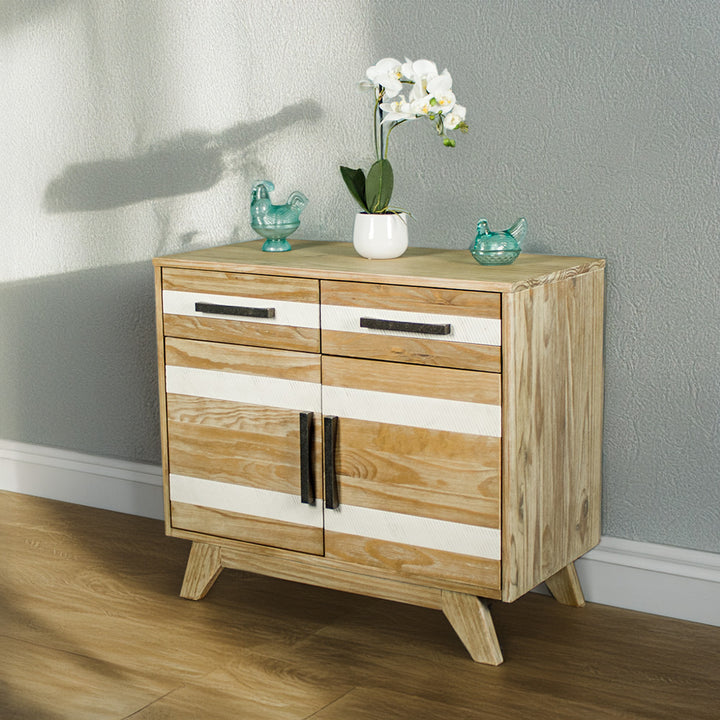 The front of the Soho 2 Door 2 Drawer NZ Pine Buffet Sideboard. There are two blue glass ornaments on top with a pot of white flowers in between.