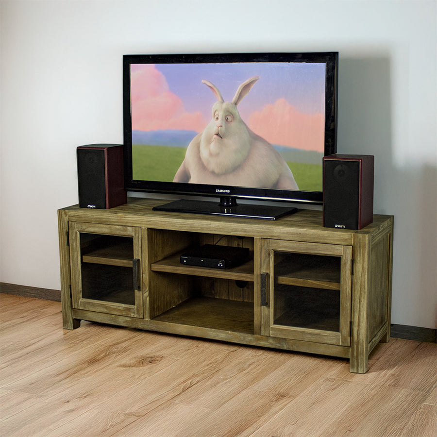 The front of the Vancouver 2 Door Entertainment Unit / TV Unit. There is a large TV on top with two speakers on either side. There is a DVD player on the top shelf in the middle of the unit.