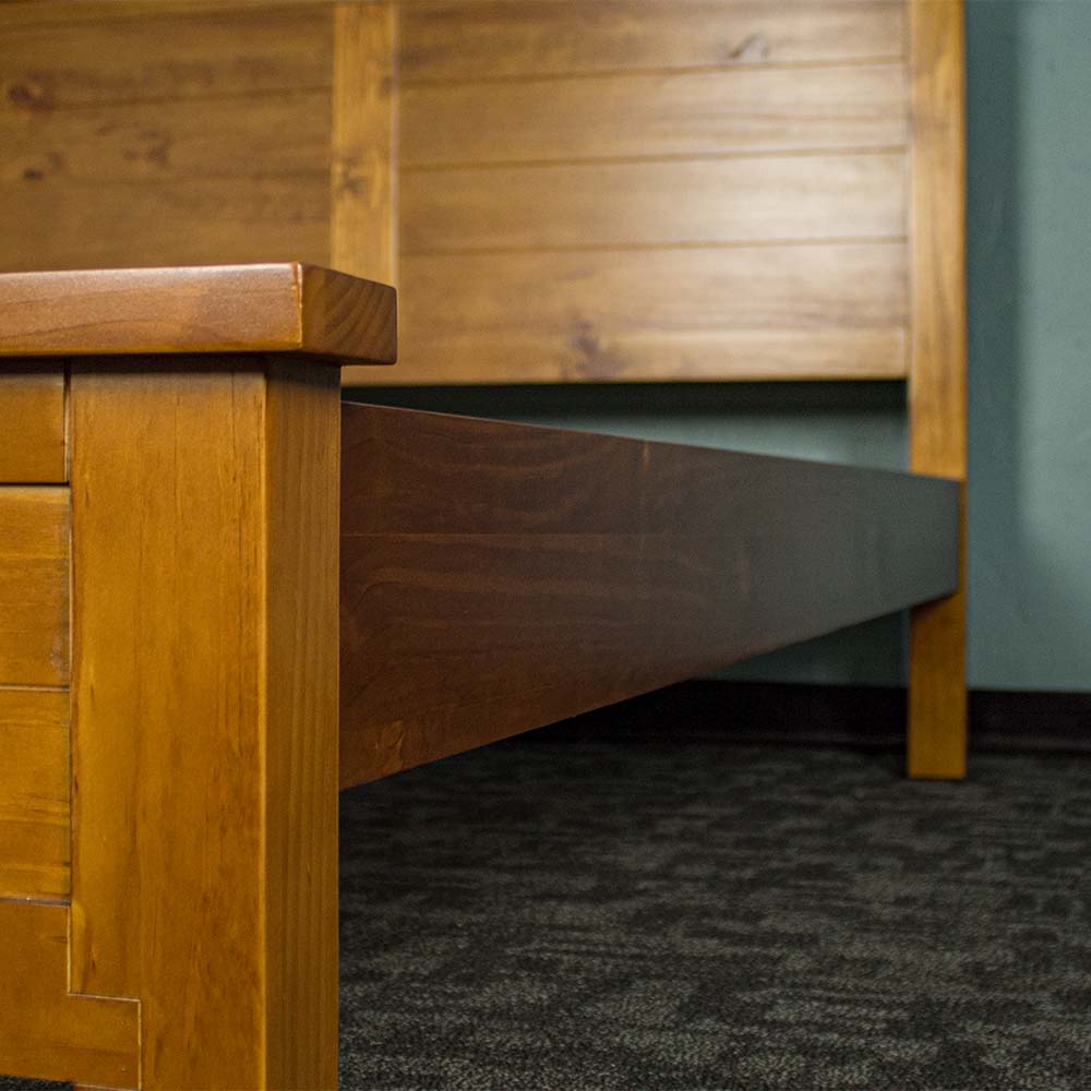 The side rails of the Alton Rimu-Stained NZ Pine King Bed Frame.