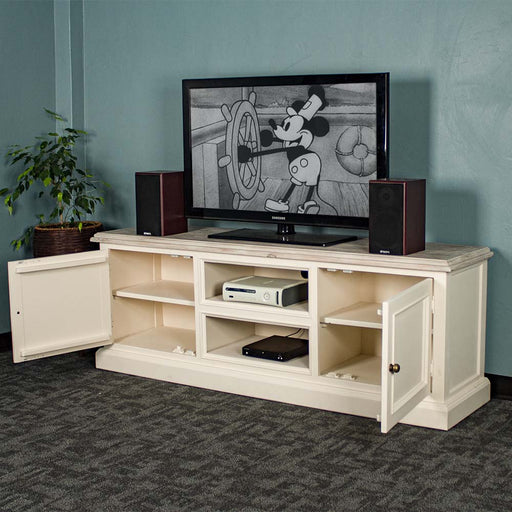 The front of the Biarritz Entertainment Unit with its doors open. There is a large TV on top with two speakers on either side. There is a game console and a DVD player on the top and bottom shelves.