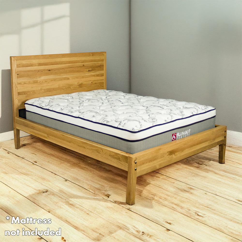 The Ormond Oak Double Bed Frame with a Slumber Posture mattress on top.