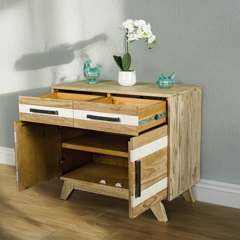 The front of the Soho 2 Door 2 Drawer NZ Pine Buffet Sideboard with its drawers and doors open. There are two blue glass ornaments on top and a pot of white flowers in between.
