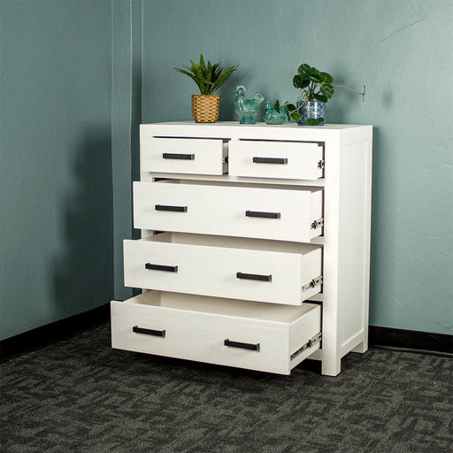 Vancouver Five Drawer White NZ Pine Tallboy with its drawers open. There are two potted plants and two blue glass ornaments on top.