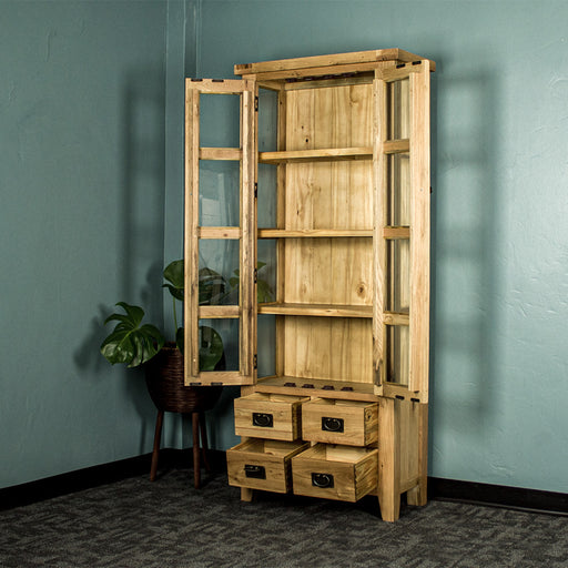 An overall view of the Yes 2 Door 4 Drawer Glass Display Cabinet with its doors and drawers open. There is a free standing potted plant next to it.