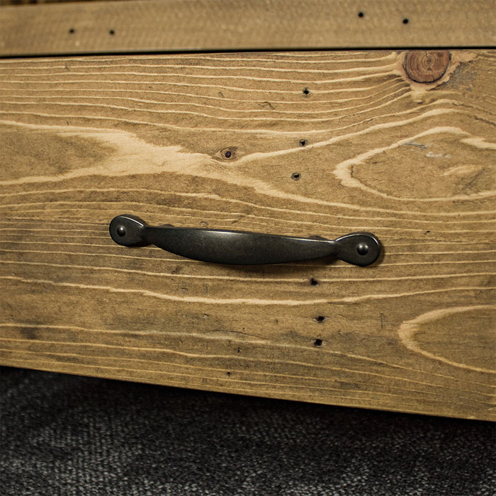 A close up of the black metal handle on the Ventura Recycled Pine Large TV Unit.