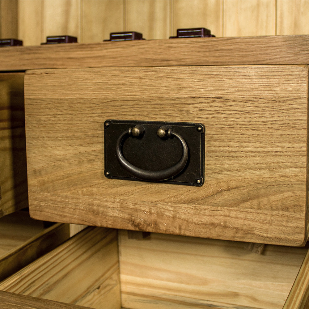 A close up of the hanging handle on the drawers of the Yes 2 Door 4 Drawer Glass Display Cabinet.