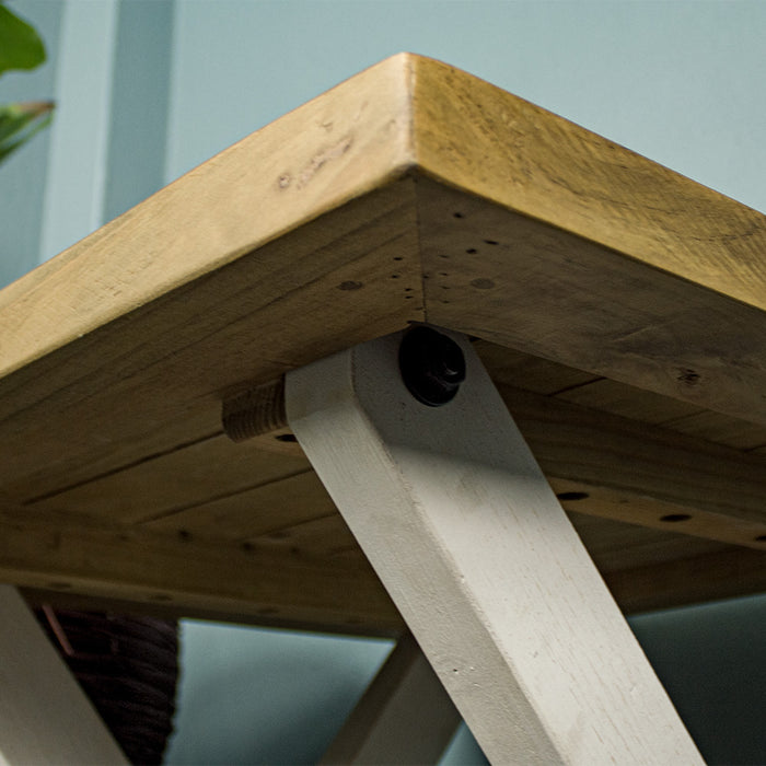 A view of the bolts that securely hold the cross legs to the top of the Byron Recycled Pine Lamp Table