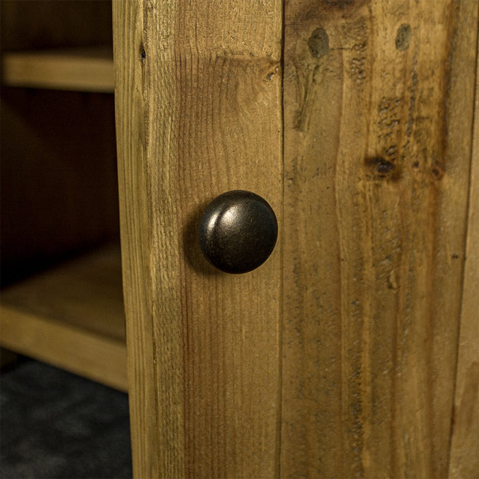 Close up of the black metal door handle on the cupboard of the Ventura Recycled Pine Buffet