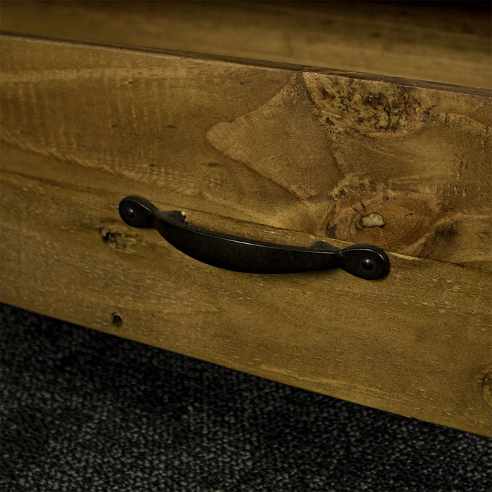 A close up of the brushed black metal handle for the drawer of the Ventura Recycled Pine Display Cabinet