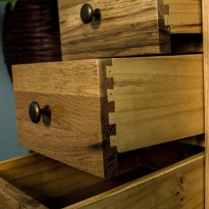 A close up of the side of the drawers on the Beethoven Oak Bedside Table with 3 Drawers, which features strong dovetail joinery.