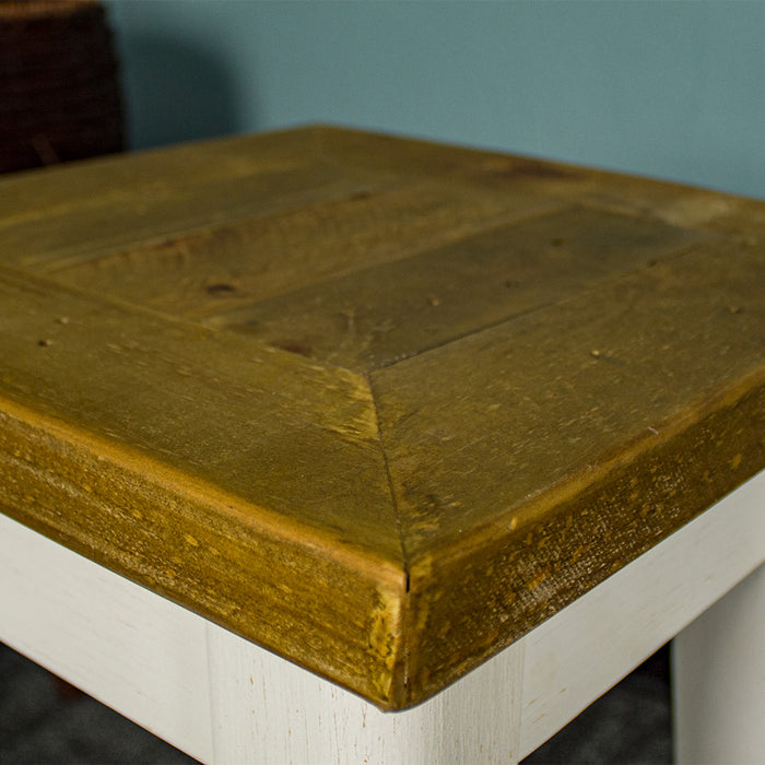 A close up of the top of the Byron Recycled Pine Stool, showing the wood grain and colour.