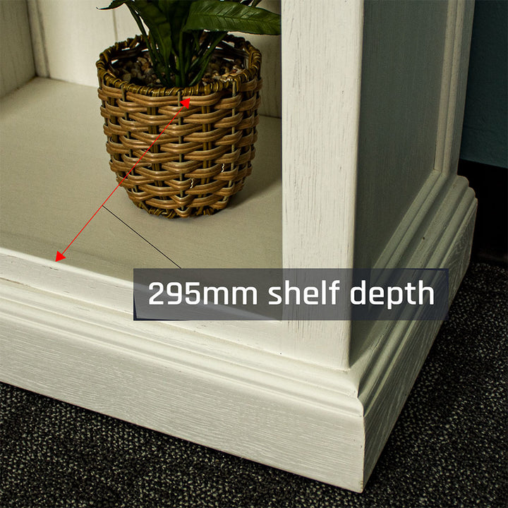 A close up of the corner of Versailles Outback Oak Bookshelf (Off White).