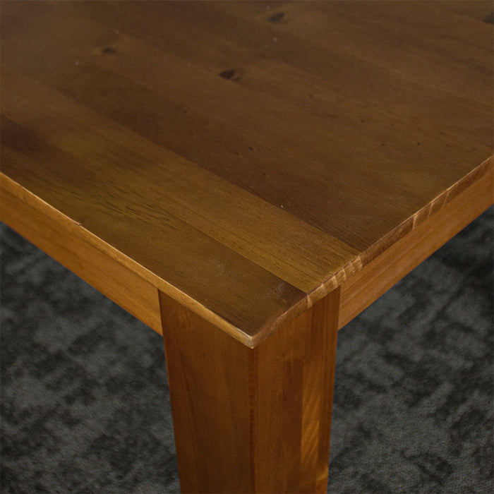 A close up of the top of the Hamilton Dining Table with Rimu Finish (1.8m)