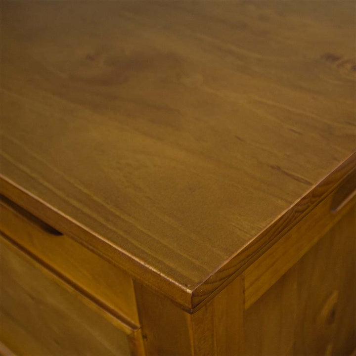 A close up of the top of the Montreal Pine Blanket Box, showing the wood grain and rimu stain.
