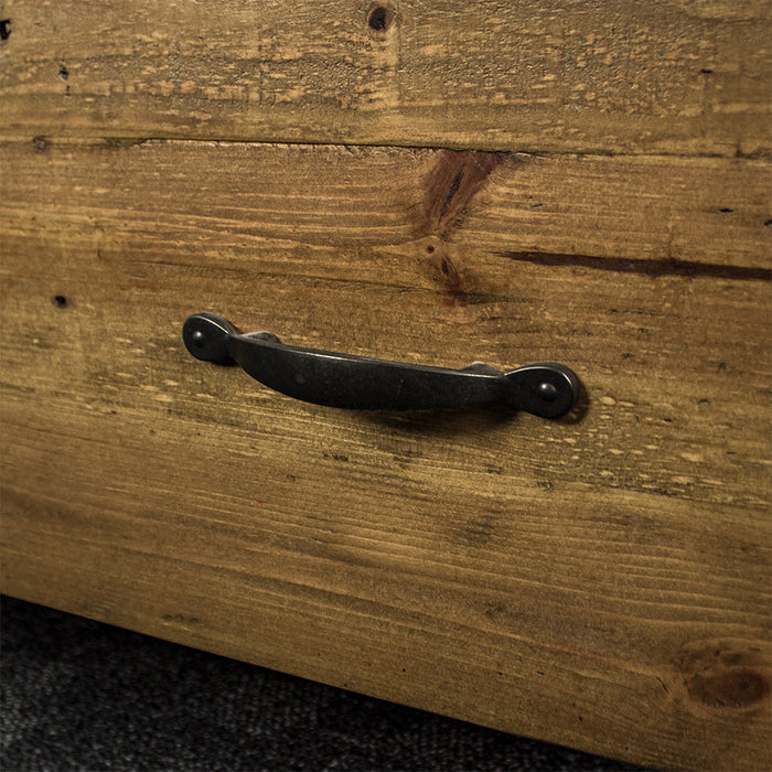 The charcoal black metal handle on the Ventura Recycled Pine Bookcase.