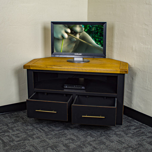The front of the Cascais Oak-top Corner Entertainment Unit with its drawers open. There is a small TV on top and a DVD player on the shelf below it.
