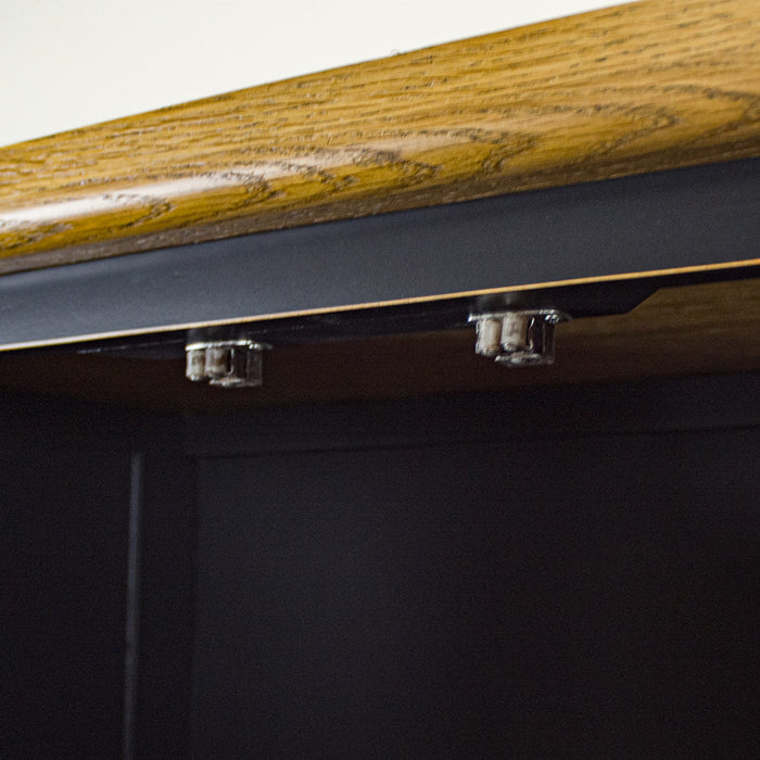 A close up of the latches that keep the door of the Cascais Oak-top Kitchen Cabinet closed securely.