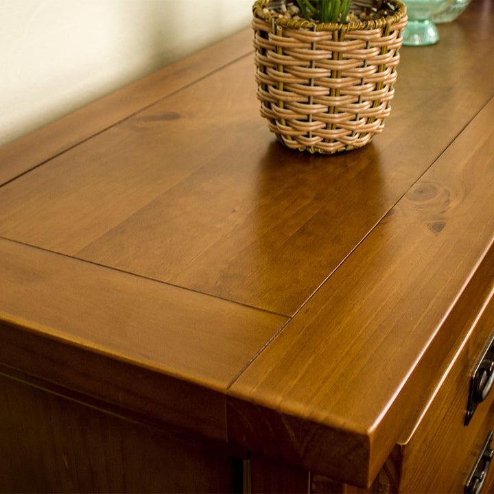 A close up of the top of the New Quebec 7 Drawer Lowboy, showing the wood grain and colour.