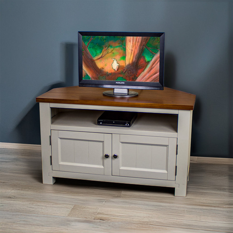 The front of the Alton Corner TV Unit. There is a small TV on top and a DVD player in the shelf.