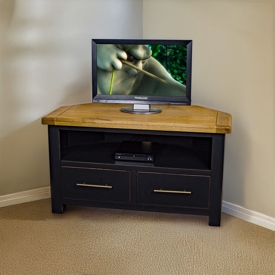 The front of the Cascais Oak-top Corner Entertainment Unit. There is a small TV on top. There is a DVD player in the middle of the shelf.