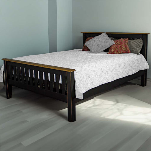 The front of the Cascais Oak Top Double Bed Frame in a modern bedroom, covered in sheets and pillows.