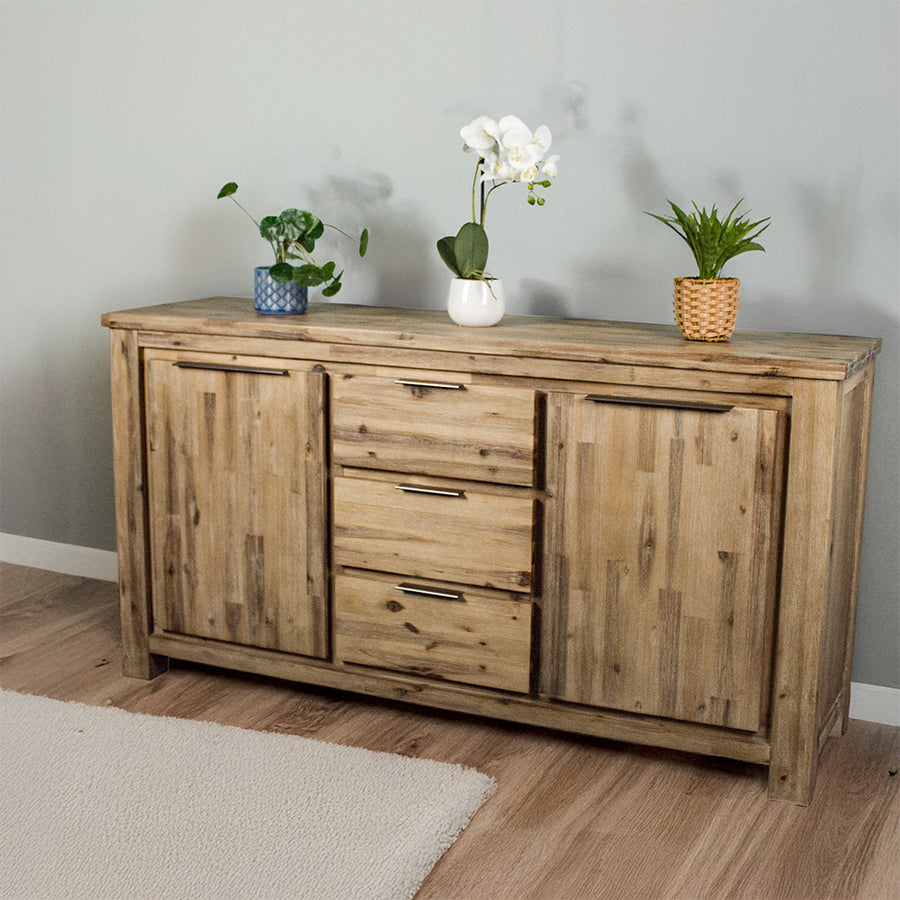The front of the Mars 3 Drawer Large Buffet, with three potted plants on top.