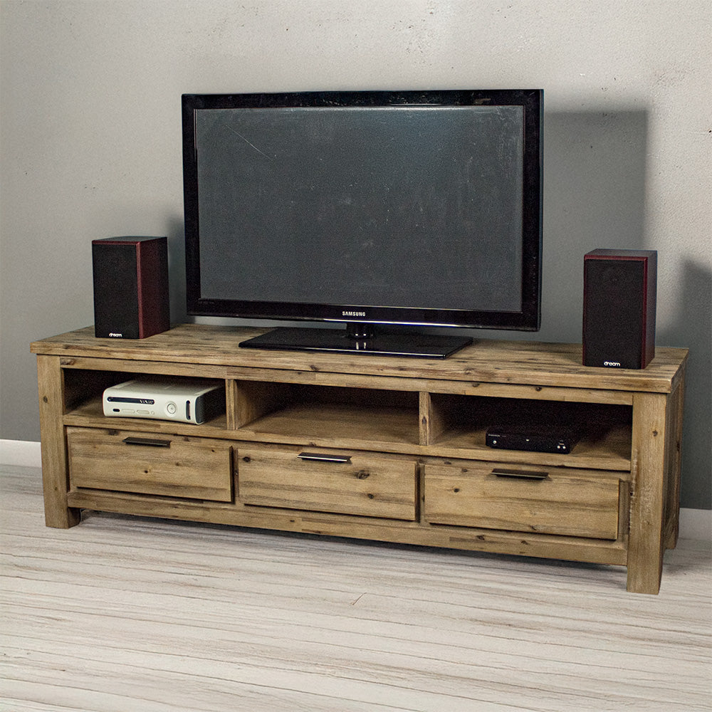 The front of the Mars 1.8m Large TV Unit. There is a TV on top with two speakers on either side. There is a gaming console in the left shelf, and a DVD player on the right shelf.