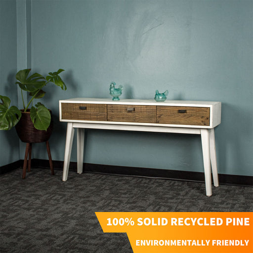 Front of the Nova Recycled Pine Console Table with three drawers. There are two blue glass ornaments on top.
