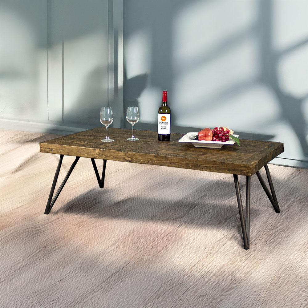 Front view of the Paddington Recycled Pine Coffee Table. There is a fruit platter, two glasses and a glass bottle on top.