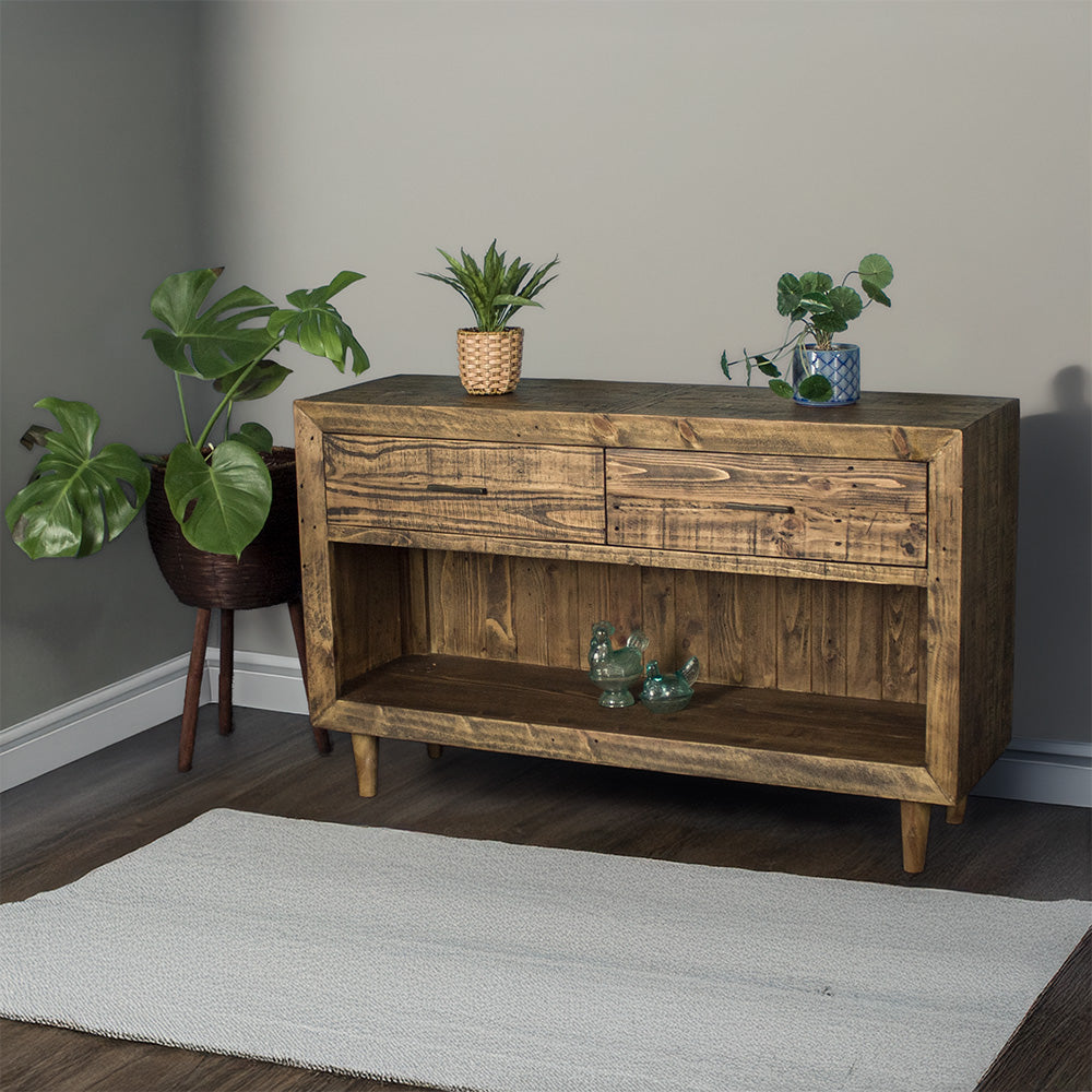 Paddington Recycled Pine Buffet / Hall Table front view. There are two potted plants on the top and two glass ornaments on the lower shelf.