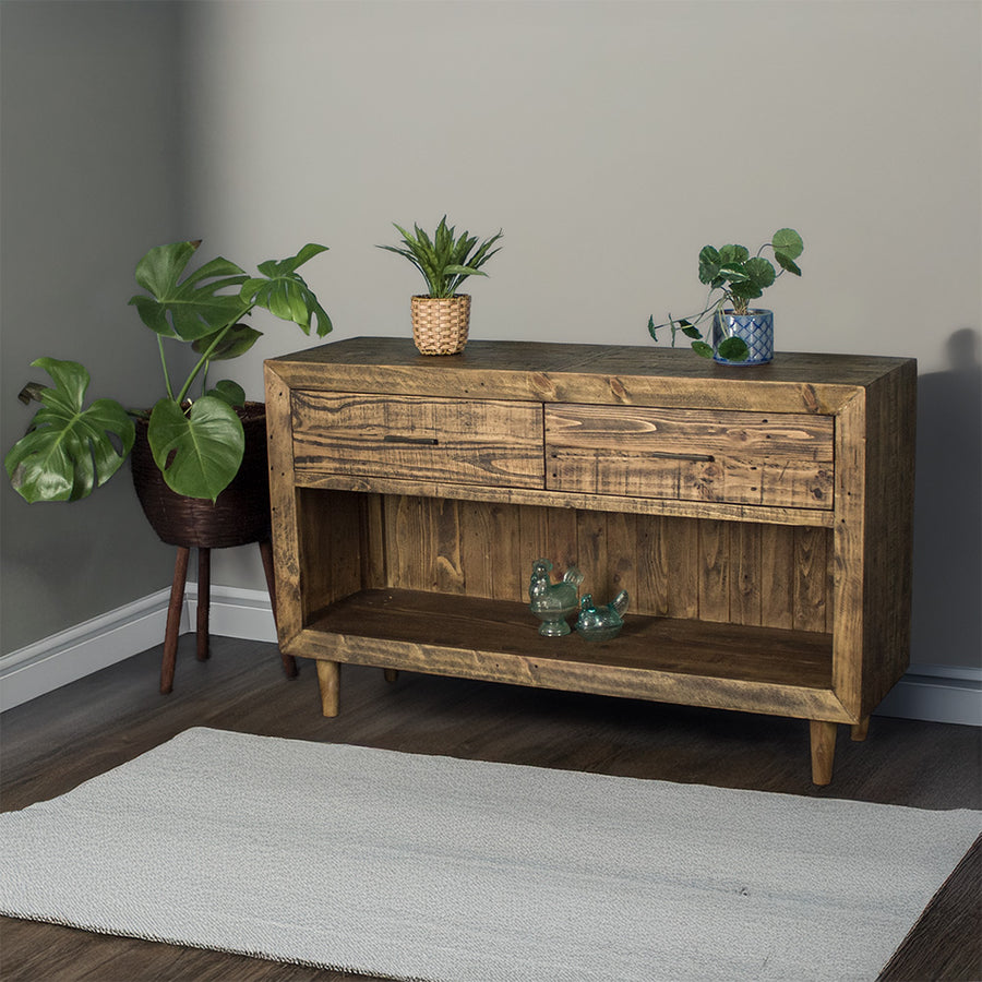 Paddington Recycled Pine Buffet / Hall Table front view. There are two potted plants on the top and two glass ornaments on the lower shelf.