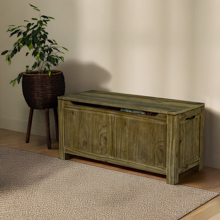 The front of the Vancouver NZ Pine Blanket Box. There is a free standing potted plant next to the blanket box.