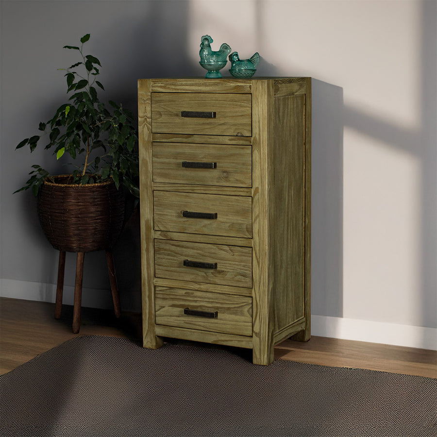 The front of the Vancouver 5 Drawer NZ Pine Lingerie Chest. There are two blue glass ornaments on top and a free standing potted plant to the left.