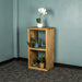 The front of the Vancouver Value Double Cube Oak Shelf with a white pot of white flowers on top, a potted plant and blue glass ornament on the top shelf and a blue glass ornament and potted plant on the bottom shelf.