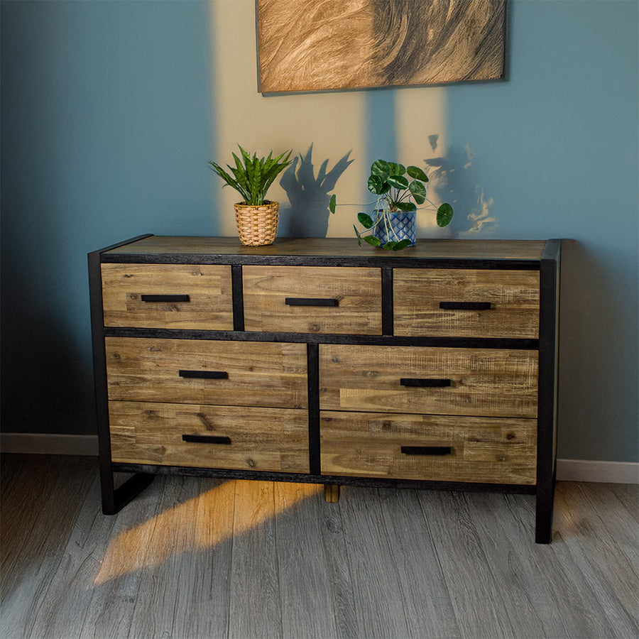 Front of the Victor 7 Drawer Lowboy. There are two potted plants on top.