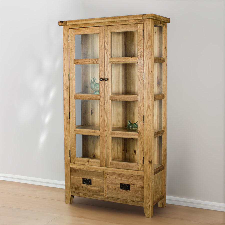 The front of the Vienna Oak Glass Display Cabinet. There are two blue glass ornaments in the windows of the two middle shelves.