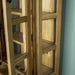 A view of the side of the Yes 2 Door 4 Drawer Glass Display Cabinet