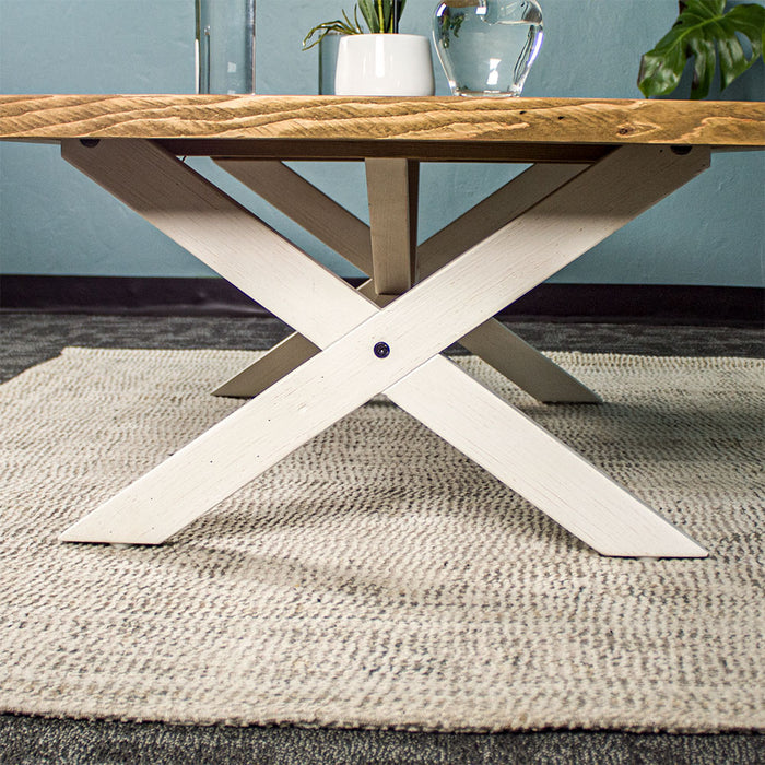 Close up of the cross legs on the Byron Recycled Pine Coffee Table, with the support bar through the middle.