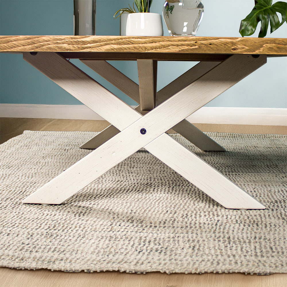 Close up of the cross legs on the Byron Recycled Pine Coffee Table, with the support bar through the middle.