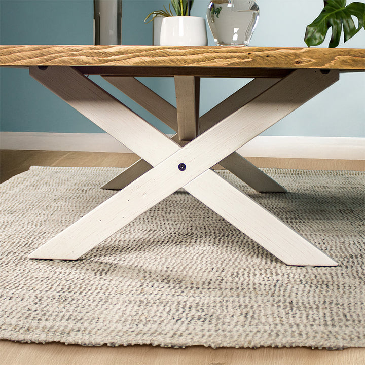 Close up of the cross legs on the Byron Recycled Pine Coffee Table, with the support bar through the middle.
