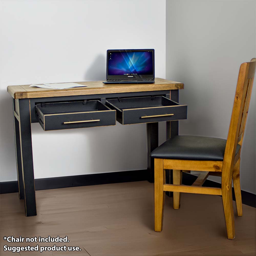 The front of the Cascais Black Desk with its drawers open. There is a laptop and papers on top of the desk and an upholstered pine dining chair in front.
