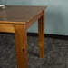 The side of the Hamilton Dining Table with Rimu Finish (1.8m)