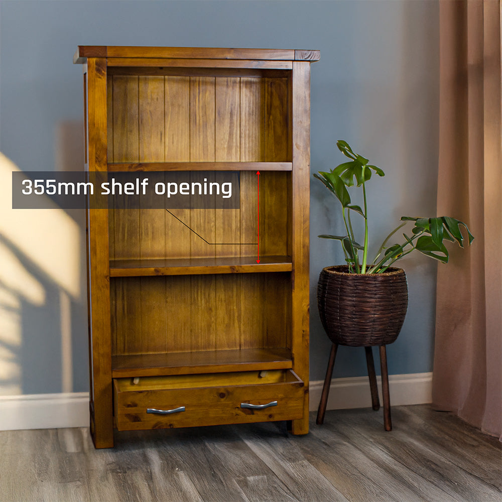 The front of the Monaco Bookcase with its drawers open. There is a free standing potted plant next to it.