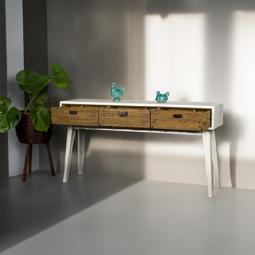 Front of the Nova Recycled Pine Console Table with its drawers open with three drawers. There are two blue glass ornaments on top.