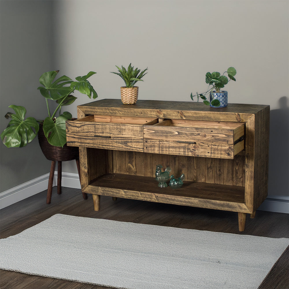 Paddington Recycled Pine Buffet / Hall Table front view with its drawers open. There is two potted plants on top and two blue glass ornaments on the lower shelf.