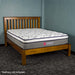 The front of the Trent Queen Size NZ Pine Slat Bed Frame with a Euro Top Pocket Spring Mattress on top.
