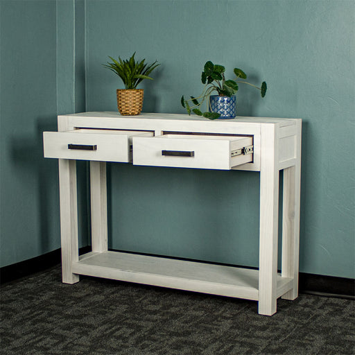 Vancouver 2 Drawer White Pine Hall Table front view with its two drawers open. There are two potted plants on top.
